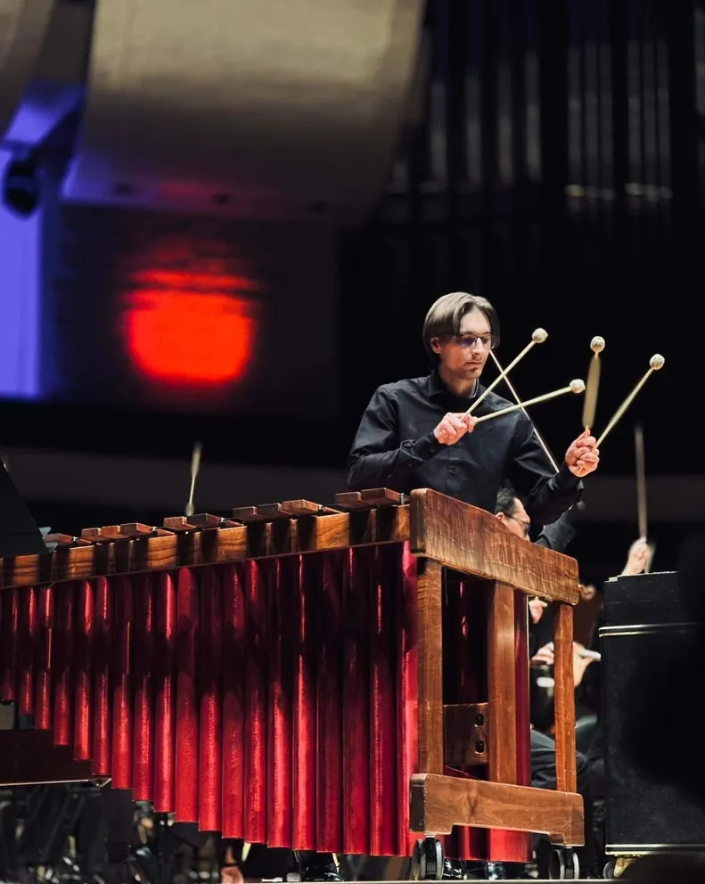 Jacob Kryger performing marimba on stage with an orchestra